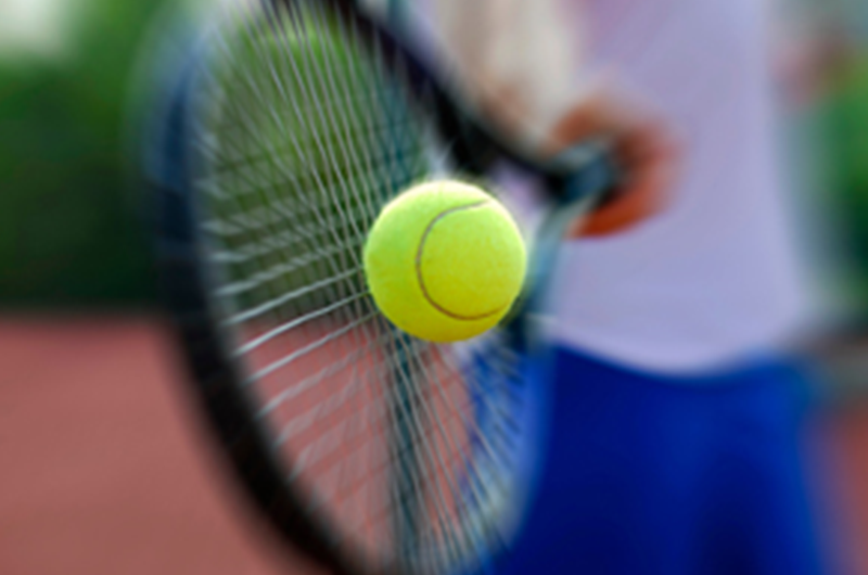 player hitting the ball with a racket